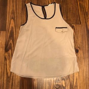 Sleeveless top with navy blue border.